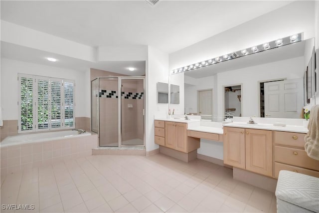 858 Wyndemere Way, Naples, FL 34105 - bathroom with vanity, a bath, a stall shower, and tile patterned flooring