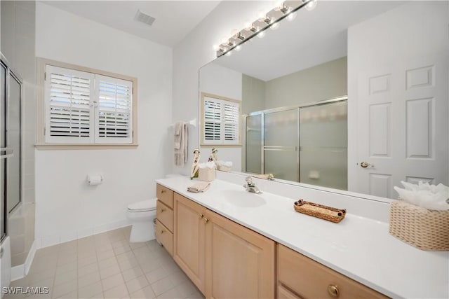 858 Wyndemere Way, Naples, FL 34105 - full bath with vanity, plenty of natural light, tile patterned floors, and shower / bath combination with glass door