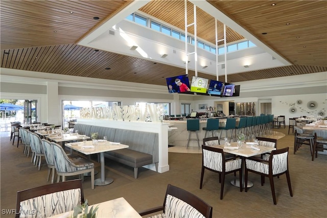 858 Wyndemere Way, Naples, FL 34105 - dining room with carpet floors, a high ceiling, and wooden ceiling