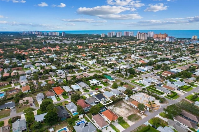 717 95th Ave N, Naples, FL 34108 - aerial view of property and surrounding area with nearby urban area and a nearby body of water