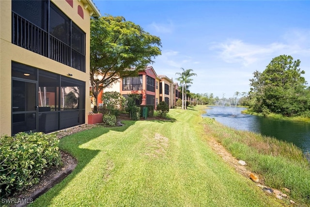 8701 Piazza Del Lago Cir Unit 101, Estero, FL 33928 - view of grassy yard with a water view
