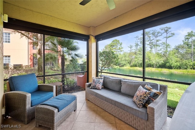 8701 Piazza Del Lago Cir Unit 101, Estero, FL 33928 - sunroom with a water view, ceiling fan, outdoor lounge area, and view of wooded area