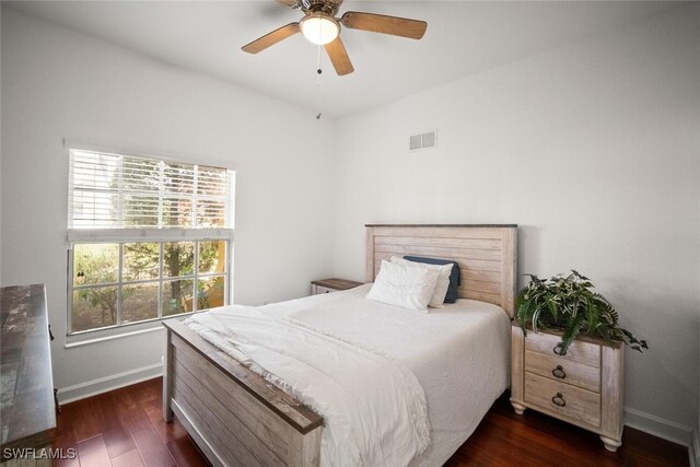 8701 Piazza Del Lago Cir Unit 101, Estero, FL 33928 - bedroom with dark wood-style floors and ceiling fan