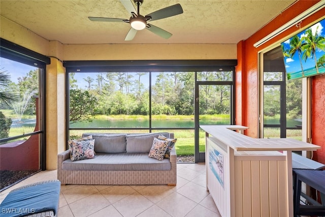 8701 Piazza Del Lago Cir Unit 101, Estero, FL 33928 - sunroom / solarium with a water view, ceiling fan, and healthy amount of natural light
