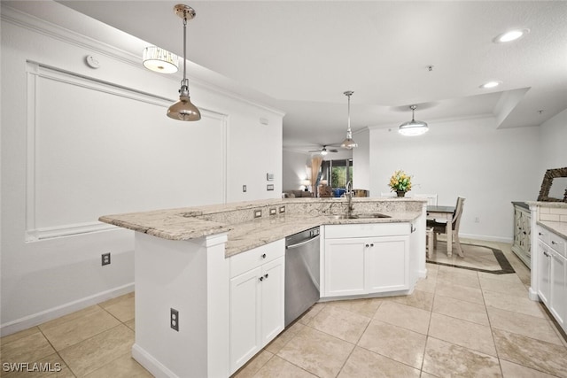8701 Piazza Del Lago Cir Unit 101, Estero, FL 33928 - kitchen with dishwasher, crown molding, white cabinetry, light stone countertops, and a center island with sink