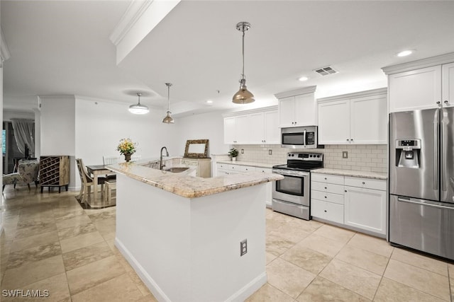 8701 Piazza Del Lago Cir Unit 101, Estero, FL 33928 - kitchen featuring appliances with stainless steel finishes, decorative backsplash, recessed lighting, white cabinets, and light stone countertops