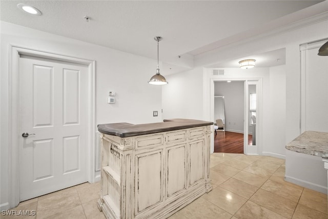 8701 Piazza Del Lago Cir Unit 101, Estero, FL 33928 - kitchen featuring light tile patterned floors, pendant lighting, dark countertops, and recessed lighting