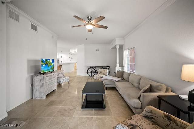 8701 Piazza Del Lago Cir Unit 101, Estero, FL 33928 - living room featuring ceiling fan, decorative columns, crown molding, and light tile patterned floors