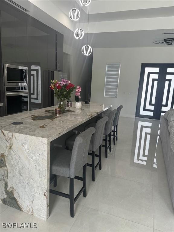 4067 33rd Ave NE, Naples, FL 34120 - dining area featuring light tile patterned floors and baseboards