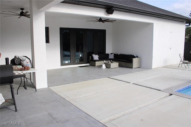 4067 33rd Ave NE, Naples, FL 34120 - view of patio / terrace featuring ceiling fan, an outdoor living space, french doors, and an outdoor pool