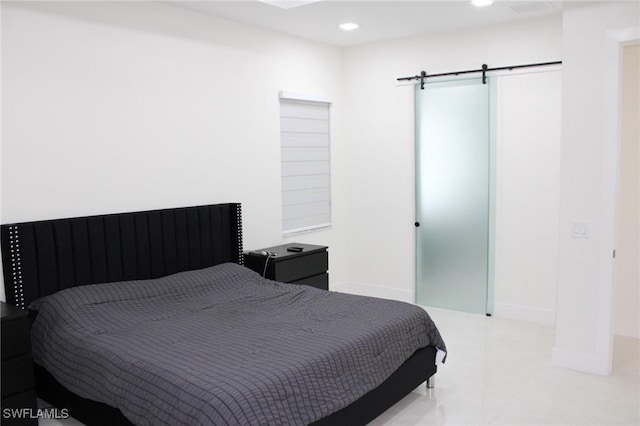 4067 33rd Ave NE, Naples, FL 34120 - tiled bedroom featuring a barn door and recessed lighting