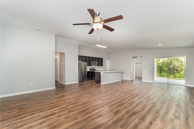 159 Kirby St, Port Charlotte, FL 33954 - unfurnished living room with wood finished floors, ceiling fan, and recessed lighting