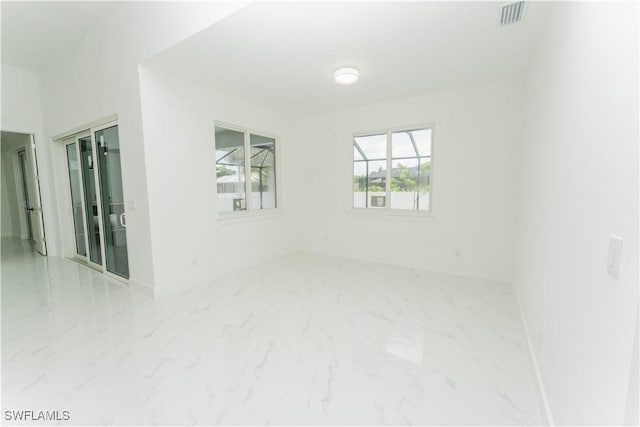 3923 NW 38th St, Cape Coral, FL 33993 - unfurnished room featuring marble look tiles and baseboards
