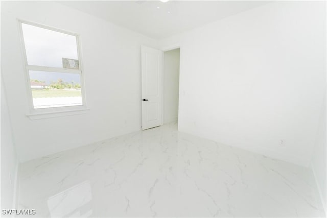 3923 NW 38th St, Cape Coral, FL 33993 - empty room with marble look tile flooring