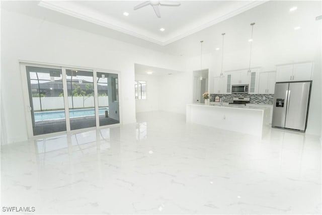 3923 NW 38th St, Cape Coral, FL 33993 - living room with crown molding, a towering ceiling, ceiling fan, and light marble finish flooring