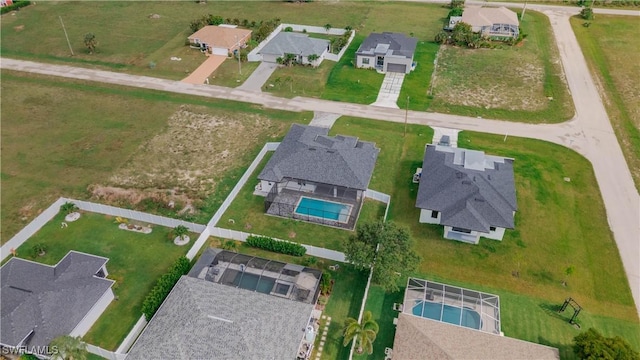 3923 NW 38th St, Cape Coral, FL 33993 - aerial overview of property's location featuring a pool and nearby suburban area