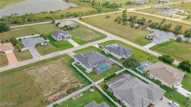 3923 NW 38th St, Cape Coral, FL 33993 - aerial perspective of suburban area featuring a nearby body of water