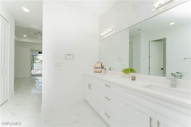 3923 NW 38th St, Cape Coral, FL 33993 - bathroom featuring marble finish floors, vanity, and recessed lighting