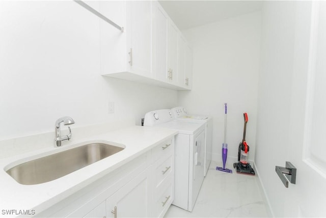 3923 NW 38th St, Cape Coral, FL 33993 - laundry room with cabinet space, washer and dryer, and light marble finish floors
