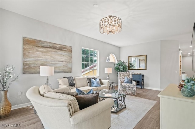 8608 Via Rapallo Dr Unit 206, Estero, FL 33928 - living area with a chandelier and wood finished floors
