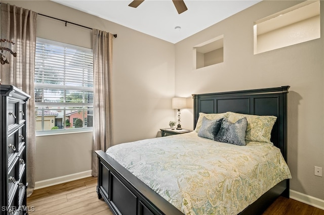 8608 Via Rapallo Dr Unit 206, Estero, FL 33928 - bedroom with light wood-style flooring and a ceiling fan