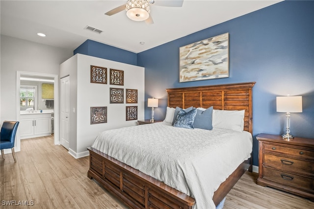 8608 Via Rapallo Dr Unit 206, Estero, FL 33928 - bedroom with light wood finished floors, ensuite bathroom, a closet, and ceiling fan