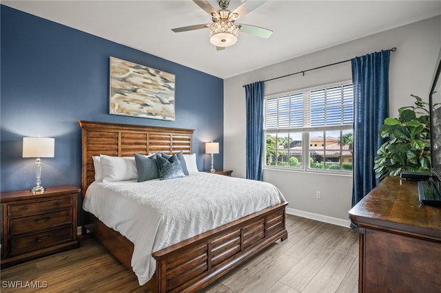 8608 Via Rapallo Dr Unit 206, Estero, FL 33928 - bedroom featuring wood finished floors and a ceiling fan