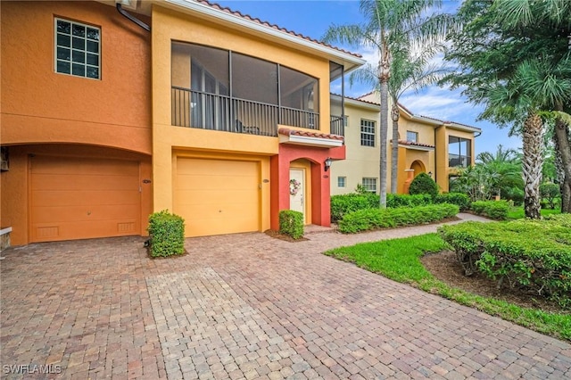8608 Via Rapallo Dr Unit 206, Estero, FL 33928 - multi unit property with a garage, stucco siding, driveway, and a tile roof