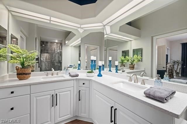 8608 Via Rapallo Dr Unit 206, Estero, FL 33928 - full bathroom with a shower stall and double vanity