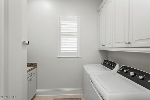 8888 Savona Ct, Naples, FL 34119 - laundry room featuring washer and clothes dryer and cabinet space