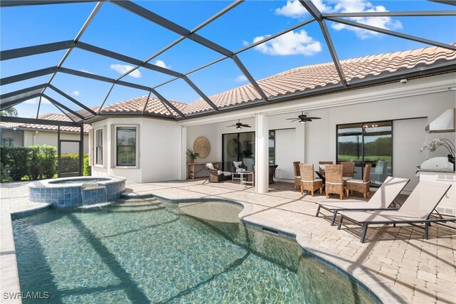 8888 Savona Ct, Naples, FL 34119 - rear view of property featuring a tiled roof, ceiling fan, and stucco siding