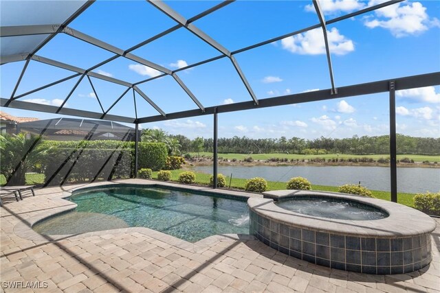 8888 Savona Ct, Naples, FL 34119 - view of pool with a water view, a patio area, a pool with connected hot tub, and a lanai