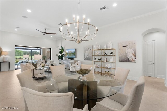 8888 Savona Ct, Naples, FL 34119 - dining room with a chandelier, recessed lighting, light tile patterned flooring, arched walkways, and crown molding