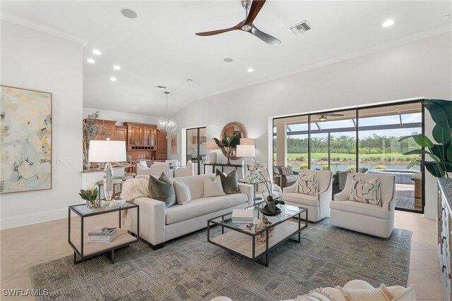 8888 Savona Ct, Naples, FL 34119 - living room with light tile patterned flooring, recessed lighting, a ceiling fan, ornamental molding, and a chandelier
