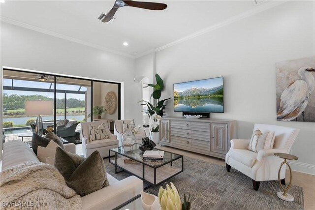 8888 Savona Ct, Naples, FL 34119 - living room with ceiling fan, ornamental molding, recessed lighting, and wood finished floors