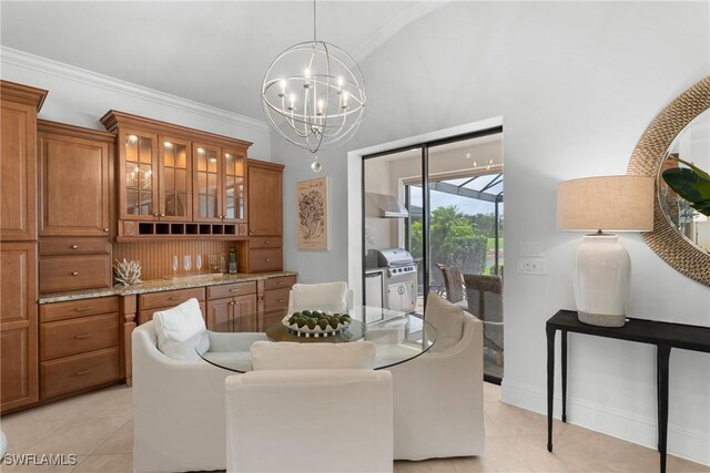 8888 Savona Ct, Naples, FL 34119 - dining area with a chandelier, light tile patterned flooring, and crown molding