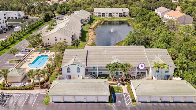 4940 Cougar Ct S Unit 104, Naples, FL 34109 - bird's eye view of a nearby body of water and a pool area
