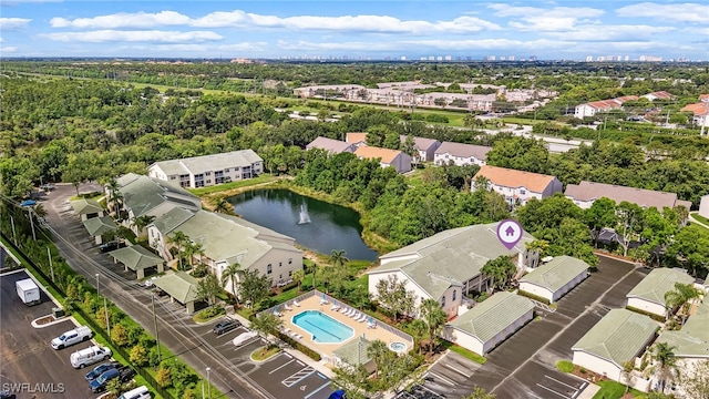 4940 Cougar Ct S Unit 104, Naples, FL 34109 - bird's eye view of a large body of water and a pool area