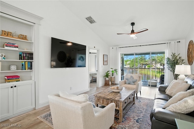 162 Pebble Shores Dr Unit 203, Naples, FL 34110 - living room featuring vaulted ceiling, ceiling fan, and light wood-style flooring
