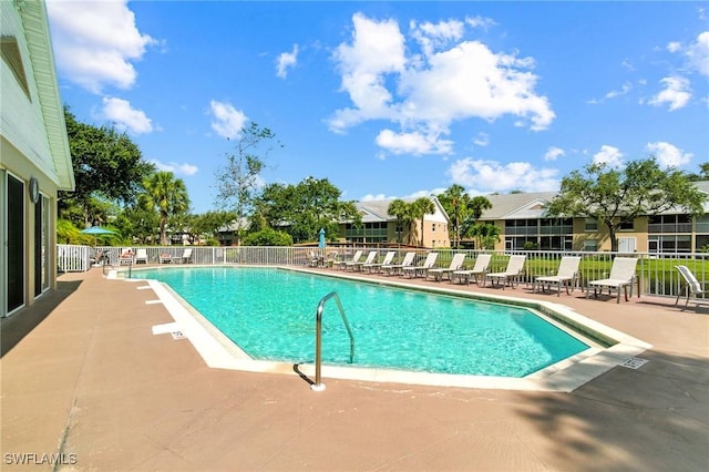 162 Pebble Shores Dr Unit 203, Naples, FL 34110 - community pool with a patio