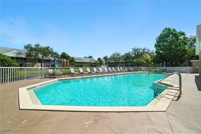 162 Pebble Shores Dr Unit 203, Naples, FL 34110 - community pool with a patio