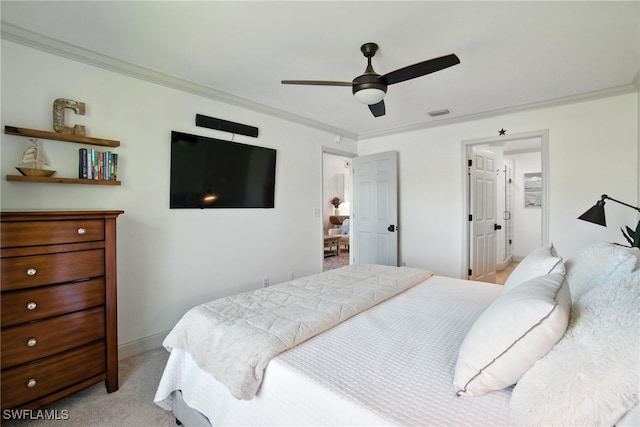 162 Pebble Shores Dr Unit 203, Naples, FL 34110 - bedroom with crown molding, light colored carpet, and a ceiling fan