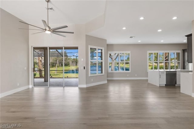 16409 Coco Hammock Way, Fort Myers, FL 34135 - unfurnished living room featuring light wood-type flooring, recessed lighting, and a ceiling fan