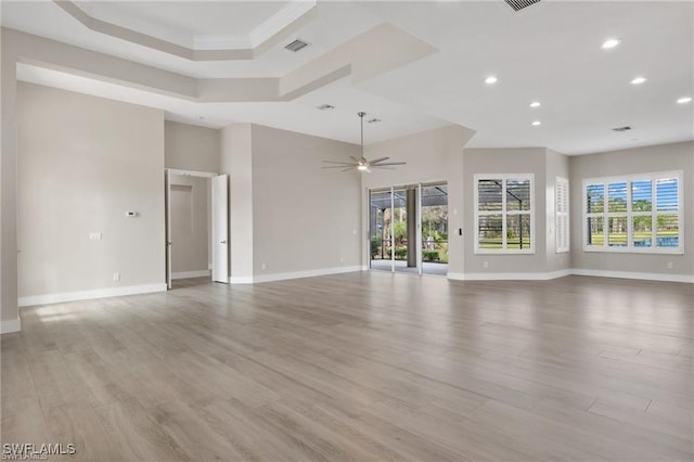 16409 Coco Hammock Way, Fort Myers, FL 34135 - unfurnished living room with recessed lighting, plenty of natural light, a ceiling fan, and light wood-style flooring