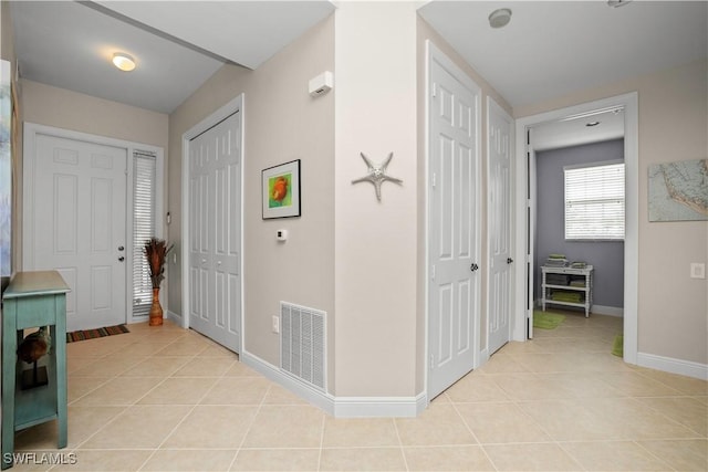 3724 Agualinda Blvd Unit 201, Cape Coral, FL 33914 - entrance foyer featuring light tile patterned flooring and baseboards