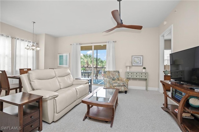 3724 Agualinda Blvd Unit 201, Cape Coral, FL 33914 - living area featuring light carpet, a chandelier, and a ceiling fan