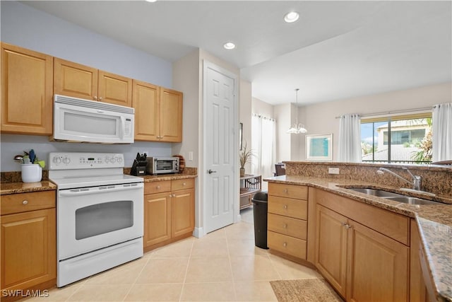 3724 Agualinda Blvd Unit 201, Cape Coral, FL 33914 - kitchen featuring white appliances, light tile patterned flooring, recessed lighting, stone countertops, and a chandelier