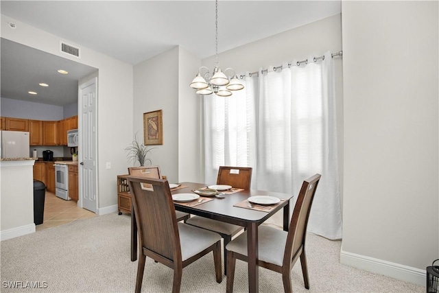 3724 Agualinda Blvd Unit 201, Cape Coral, FL 33914 - dining space with a chandelier, light colored carpet, and recessed lighting