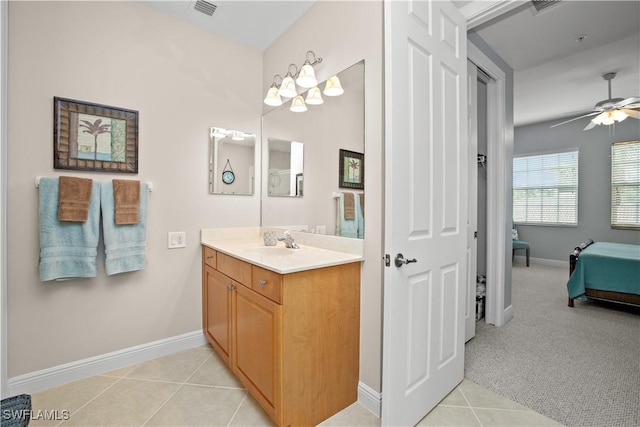 3724 Agualinda Blvd Unit 201, Cape Coral, FL 33914 - bathroom with vanity, ensuite bathroom, a ceiling fan, and tile patterned floors