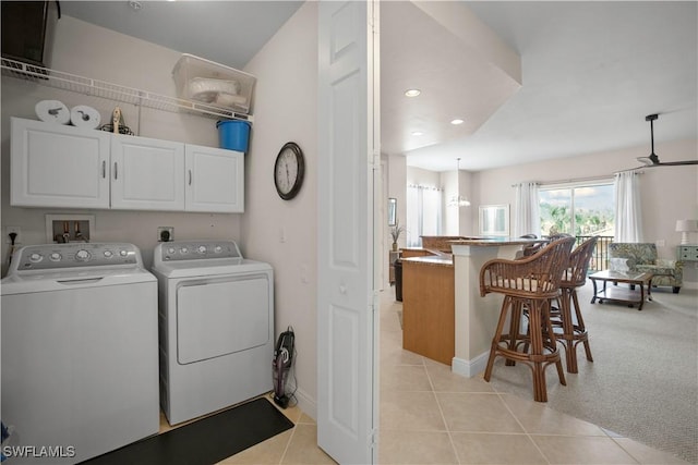 3724 Agualinda Blvd Unit 201, Cape Coral, FL 33914 - washroom with cabinet space, washer and dryer, light tile patterned flooring, and recessed lighting